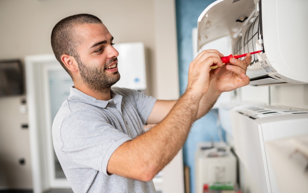 A Guy Doing HVAC Maintenance