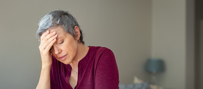 An old woman who looks worried | AC leak | A Plus Air Conditioning and Refrigeration