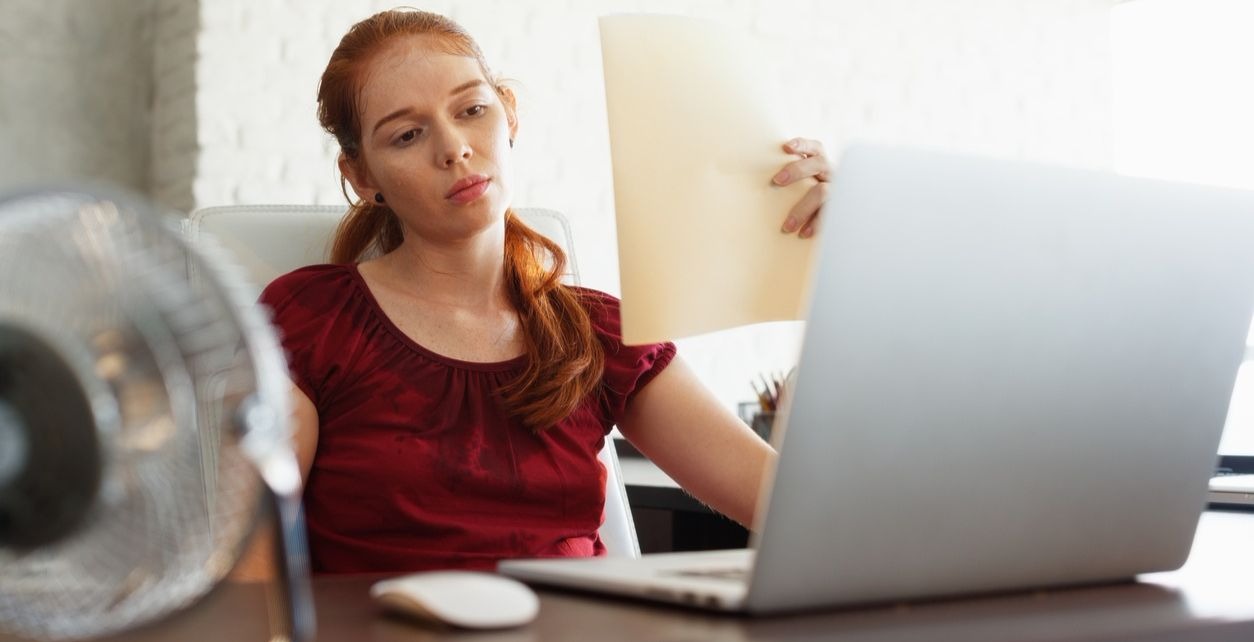 woman looking at her computer