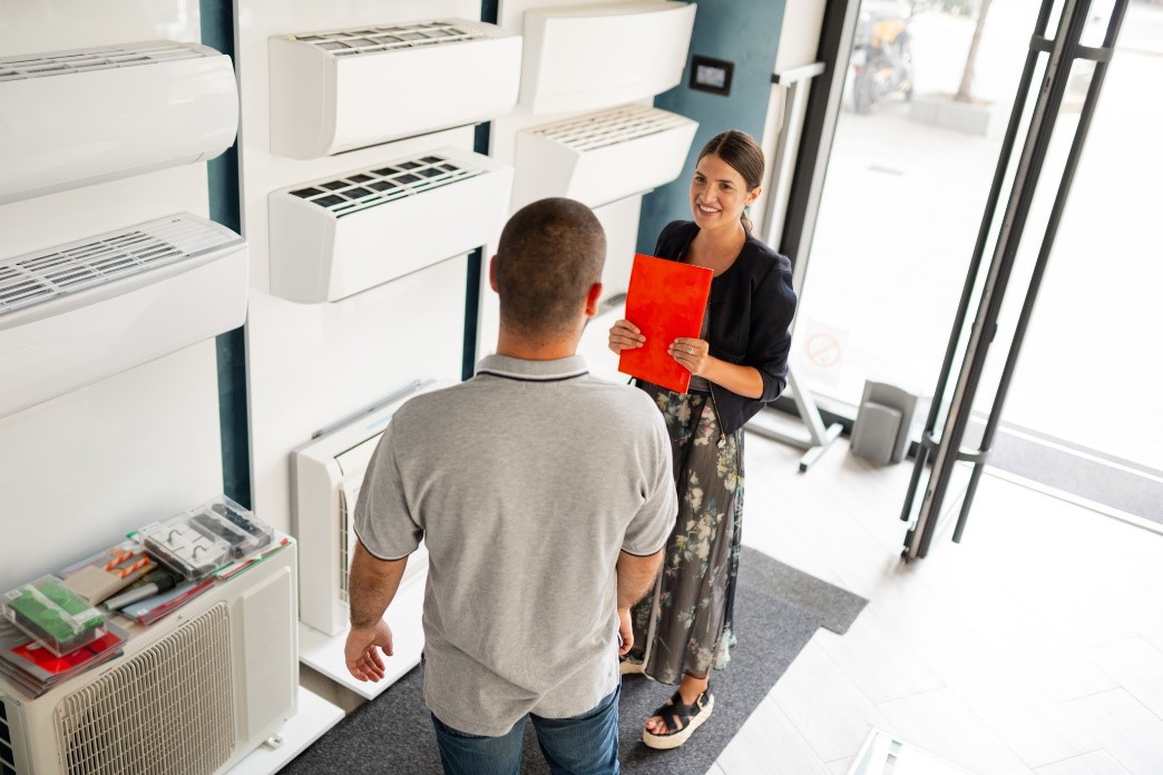 Man consulting an air conditioner