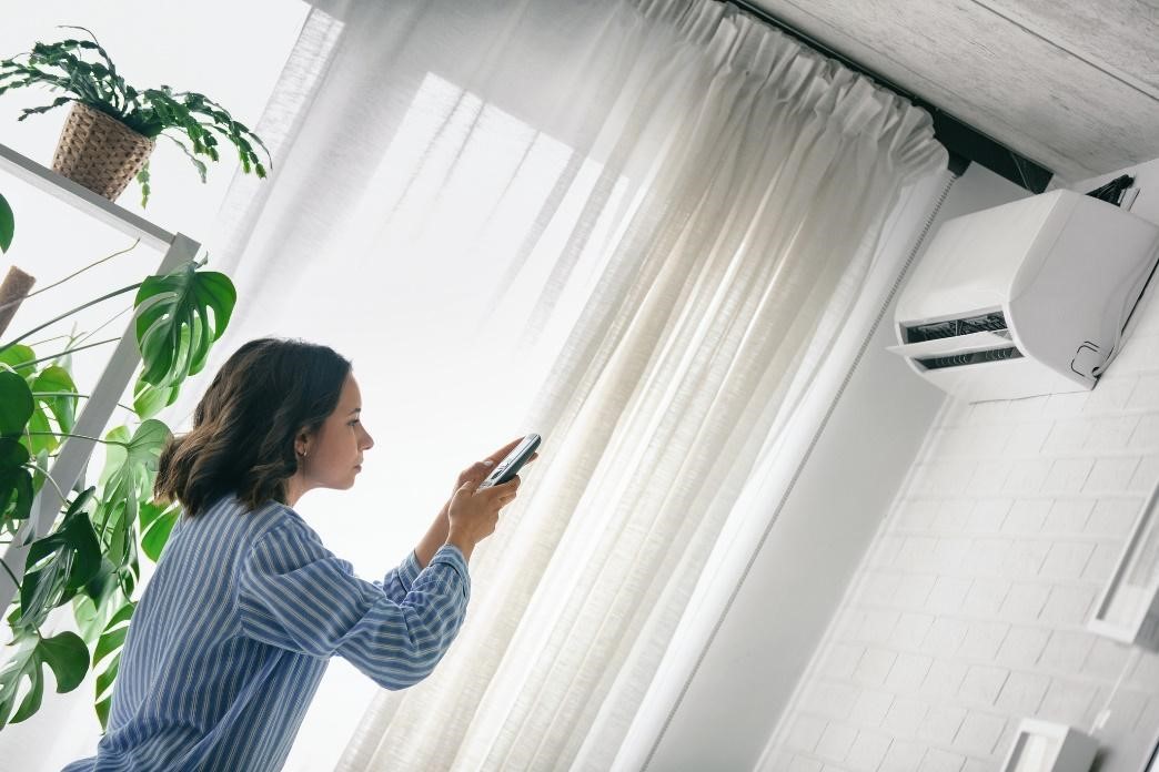 woman operating AC