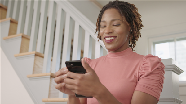 a woman looking at her mobile device